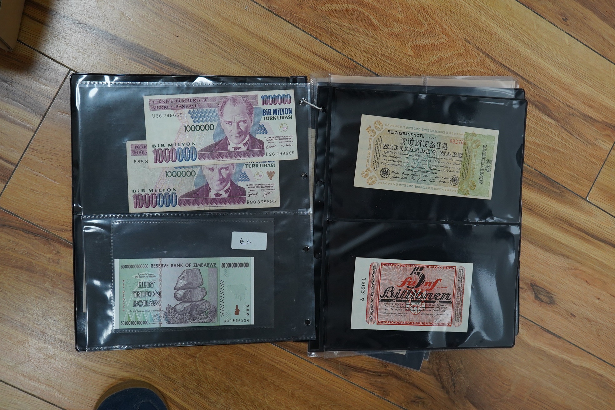 A collection of assorted world issue paper money including 1922 German doeskin, 1937 USSR Lenin, Malta P.11 1939, Zimbabwe, French Revolution British Government Forgery, 1878 Bank of Madras and Japanese.